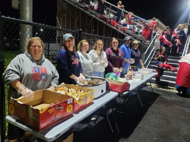 volunteers feed the marching braves